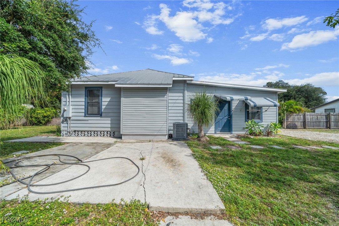 290 Granada Boulevard Fort Myers, FL 33905 - Photo 37 of 37 front view of house with a yard