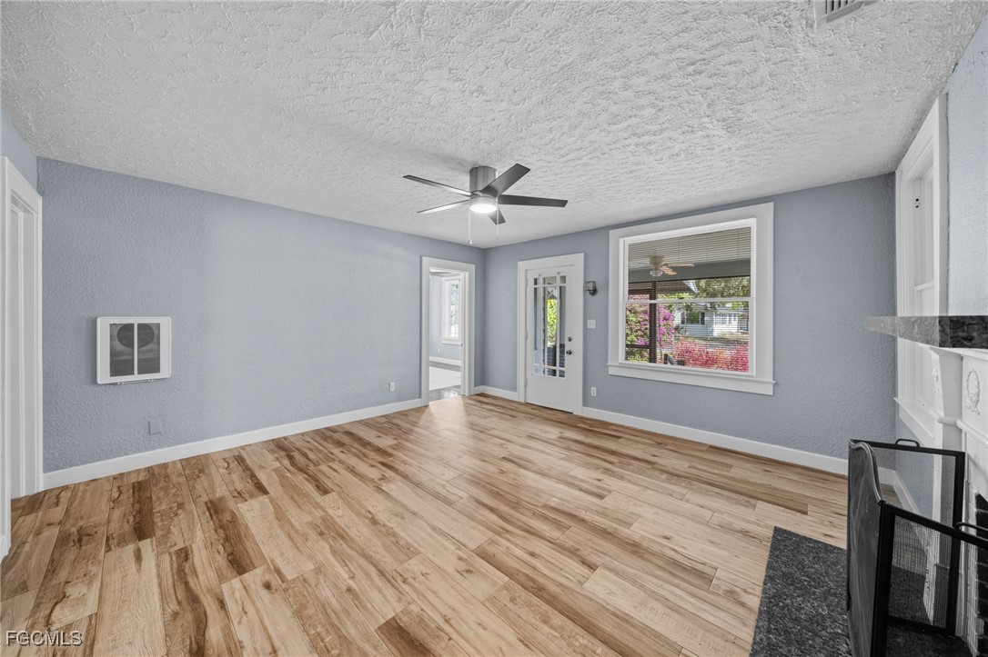 290 Granada Boulevard Fort Myers, FL 33905 - Photo 4 of 37 a view of empty room with wooden floor and fan