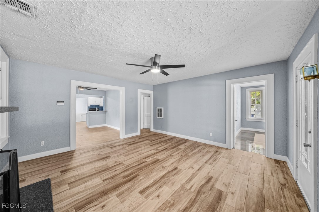 290 Granada Boulevard Fort Myers, FL 33905 - Photo 5 of 37 a view of empty room with wooden floor