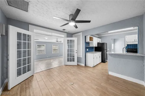 a view of a kitchen with a sink and a stove top oven