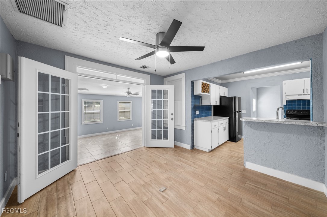 290 Granada Boulevard Fort Myers, FL 33905 - Photo 6 of 37 a view of a kitchen with a sink and a stove top oven