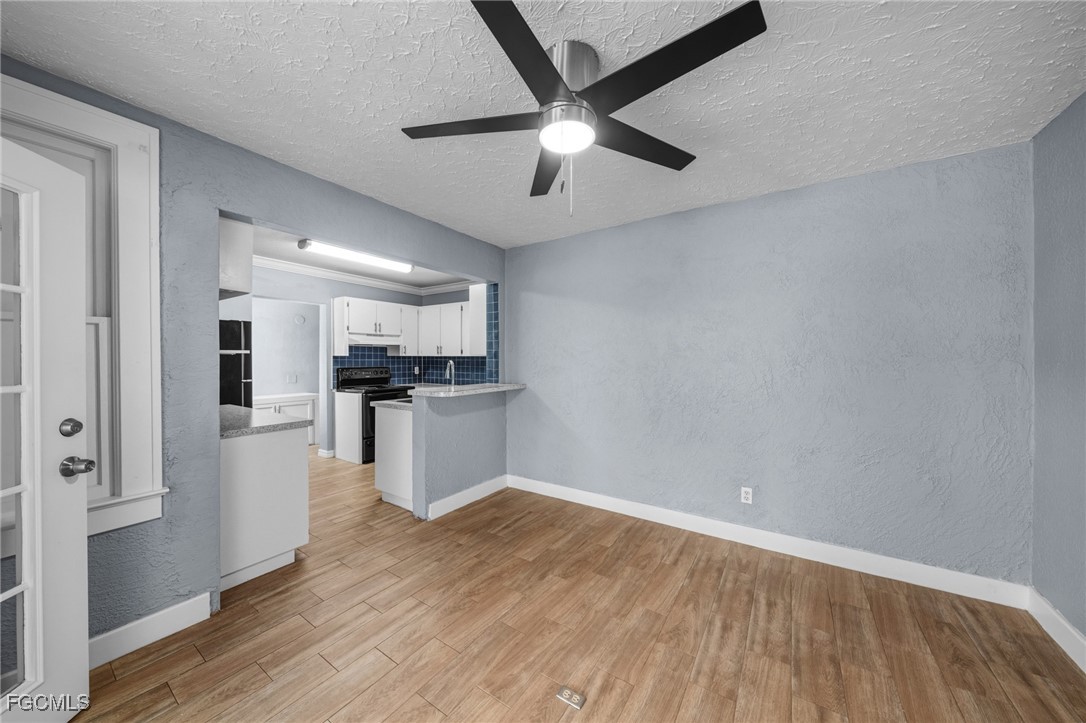 290 Granada Boulevard Fort Myers, FL 33905 - Photo 7 of 37 a view of kitchen with refrigerator microwave and stove