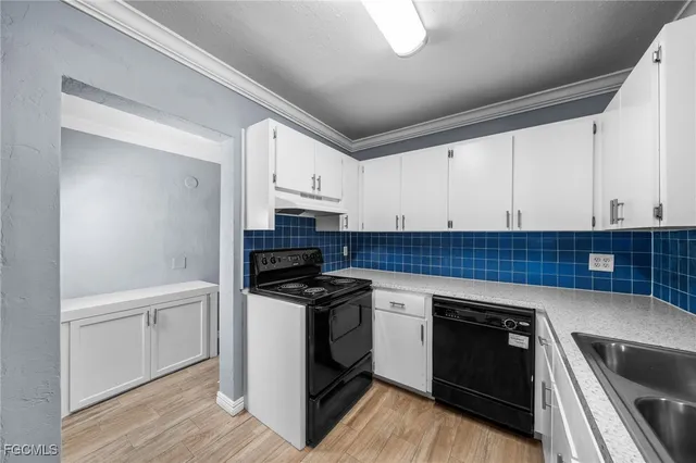 a kitchen with stainless steel appliances granite countertop a stove and a sink