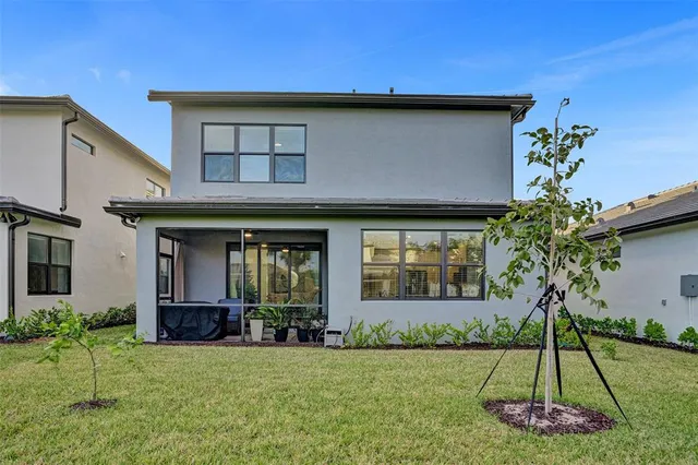 a kitchen with stainless steel appliances kitchen island granite countertop a refrigerator and a stove top oven