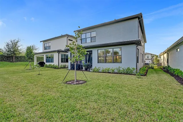 a view of kitchen with sink and refrigerator