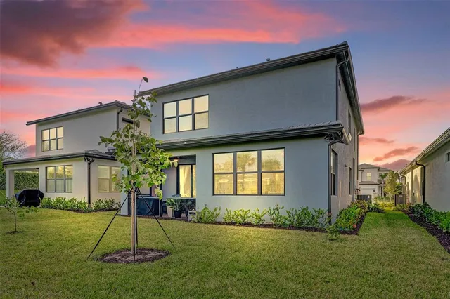 a kitchen with granite countertop a sink stainless steel appliances and cabinets