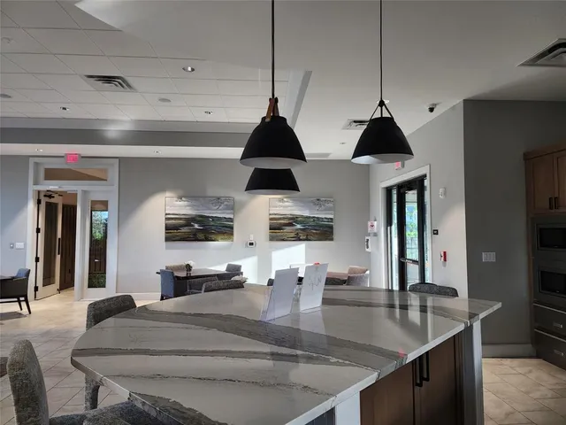 a kitchen with a stove a table and chairs