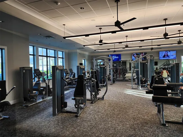 a kitchen with a sink a stove and cabinets