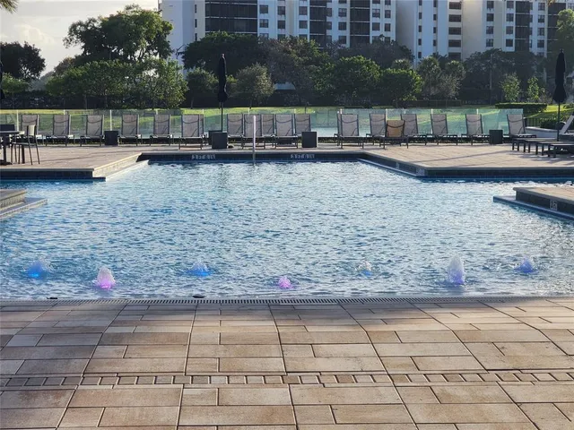 a view of a garden with large trees