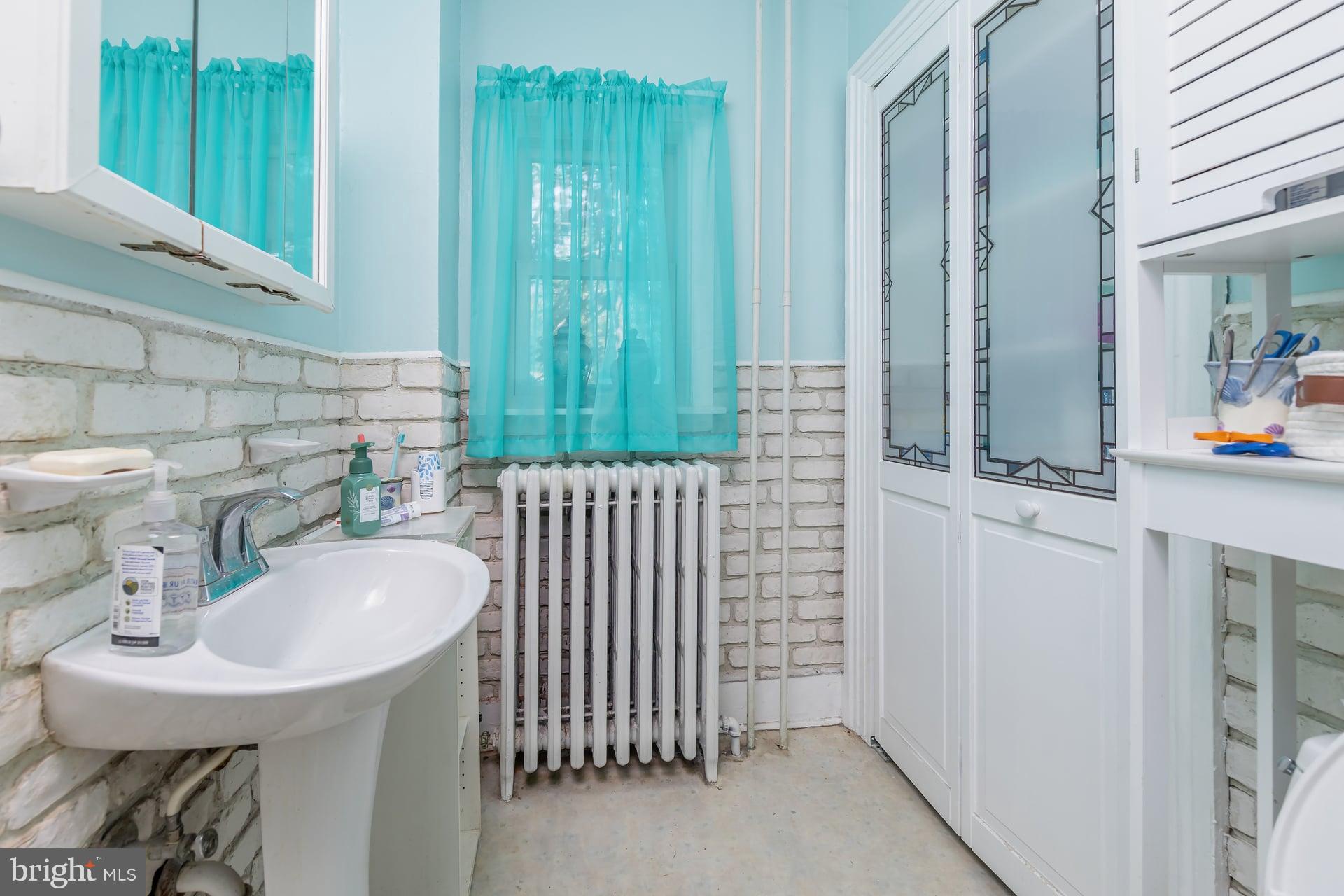 401 West Avenue Delanco, NJ 08075 - Photo 8 of 19 a bathroom with a sink and a mirror