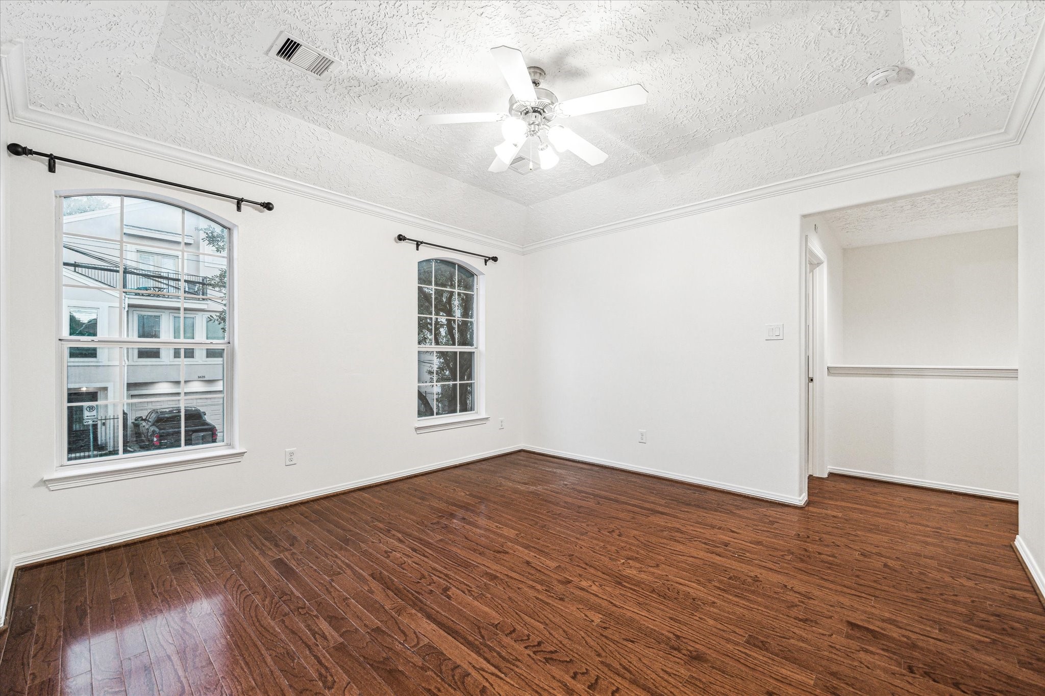 1613 West 15th Street Houston, TX 77008 - Photo 12 of 25 a view of an empty room with a window and wooden floor