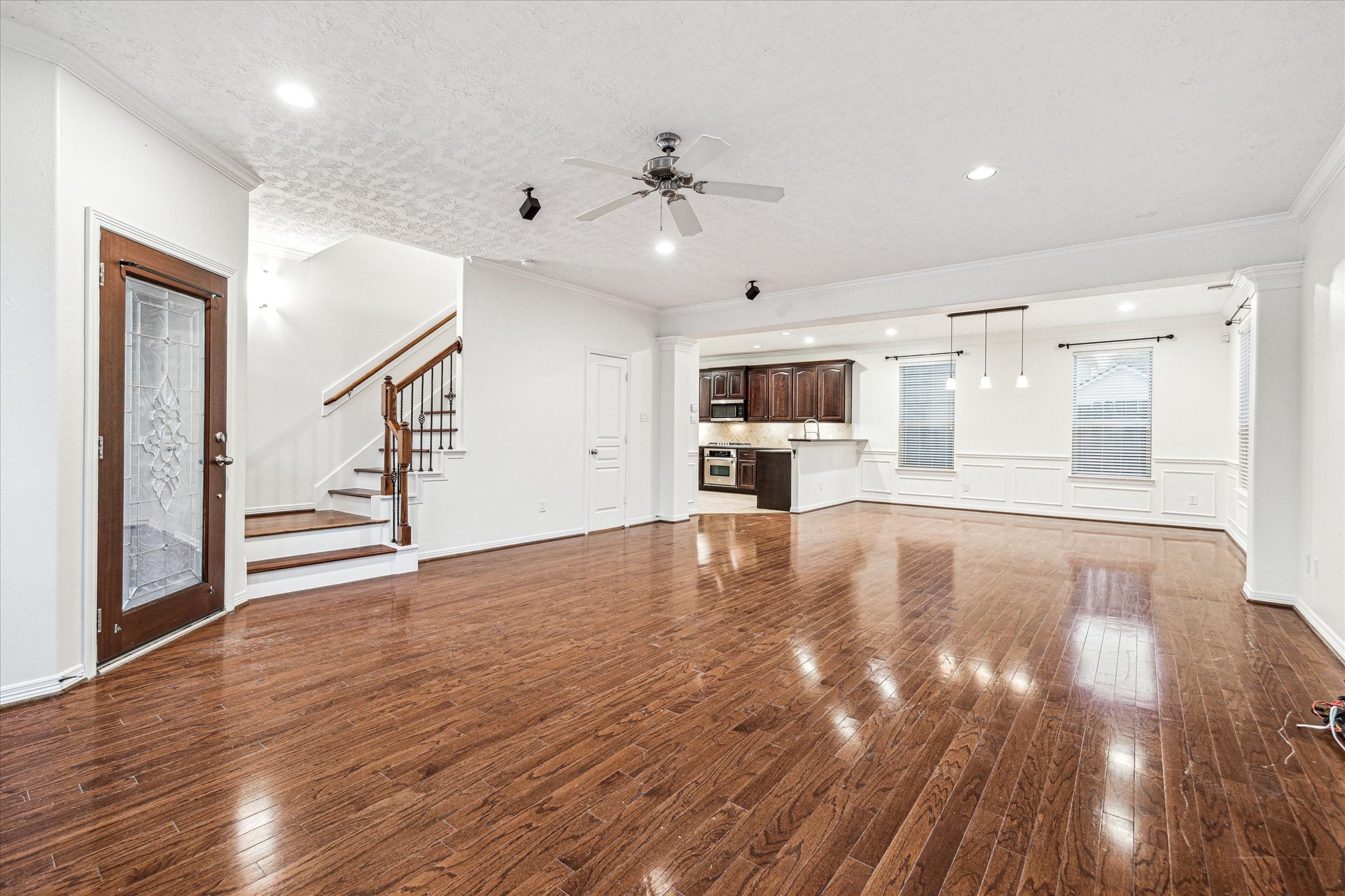 1613 West 15th Street Houston, TX 77008 - Photo 6 of 25 a view of empty room with wooden floor and fan