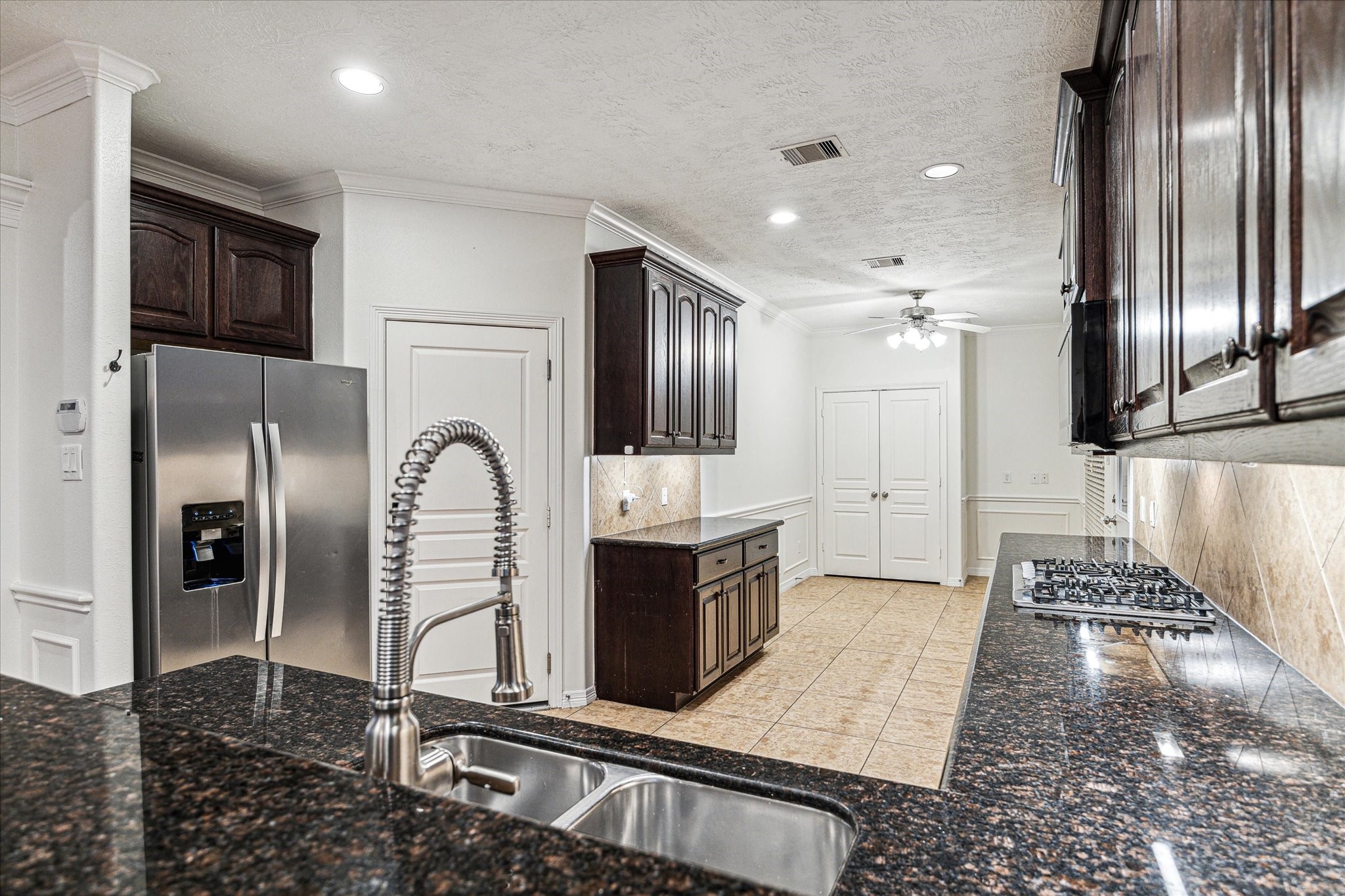 1613 West 15th Street Houston, TX 77008 - Photo 9 of 25 a kitchen with stainless steel appliances granite countertop a refrigerator a stove and a sink