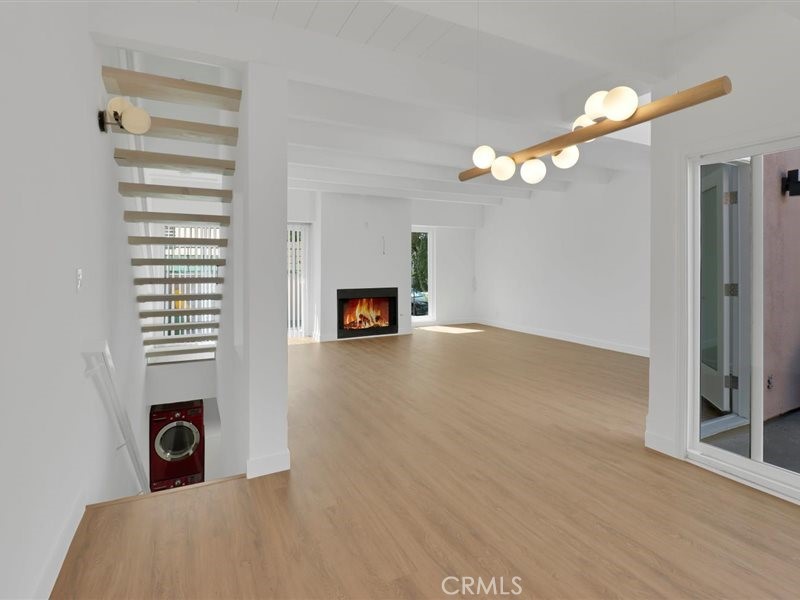 a view of a livingroom with furniture and a fireplace
