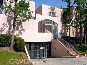 400 Monterey Road, Unit 11 Glendale, CA 91206 - Photo 12 of 14 a front view of a house with garden