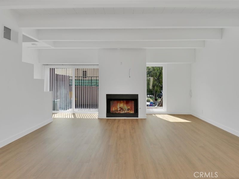 400 Monterey Road, Unit 11 Glendale, CA 91206 - Photo 2 of 14 a view of an empty room with a fireplace and a window