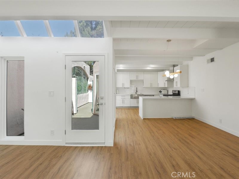 400 Monterey Road, Unit 11 Glendale, CA 91206 - Photo 6 of 14 a view of a kitchen cabinets and wooden floor