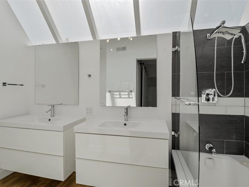 400 Monterey Road, Unit 11 Glendale, CA 91206 - Photo 9 of 14 a bathroom with a sink and a mirror