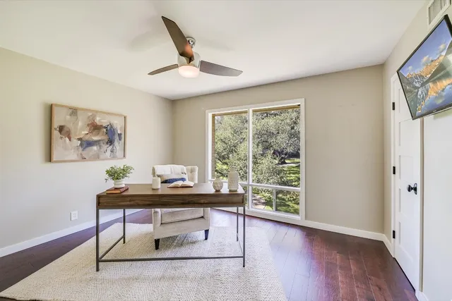 a workspace with furniture and a window