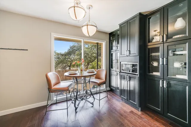 a view of a dining room with furniture window and wooden floor