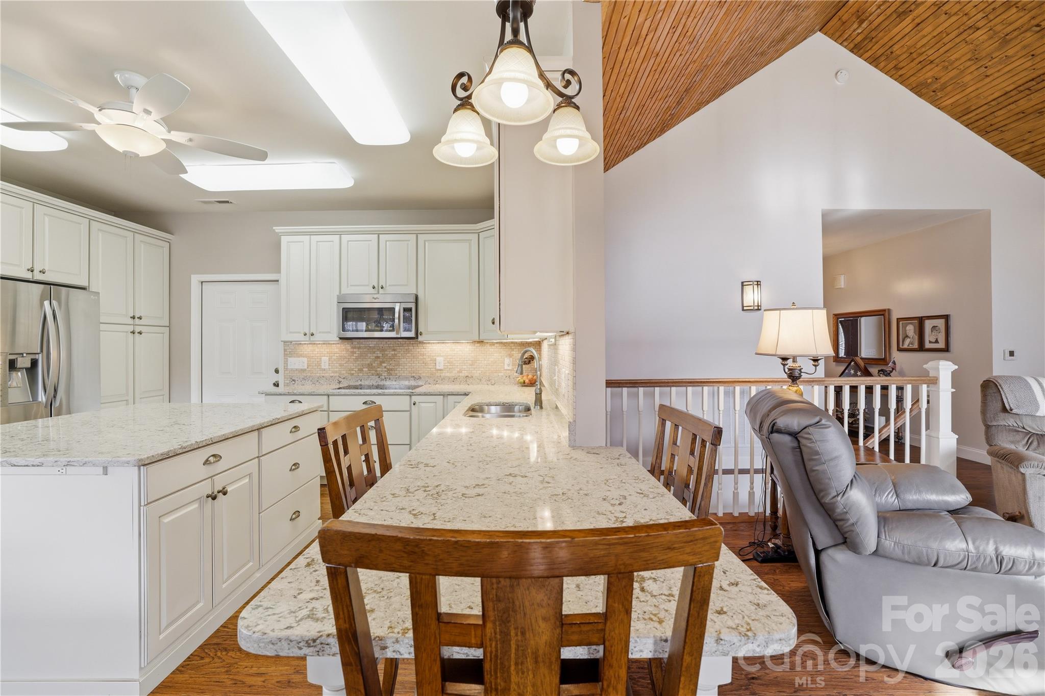140 Debbie Loop Waynesville, NC 28786 - Photo 15 of 47 a view of a dining room with furniture and wooden floor