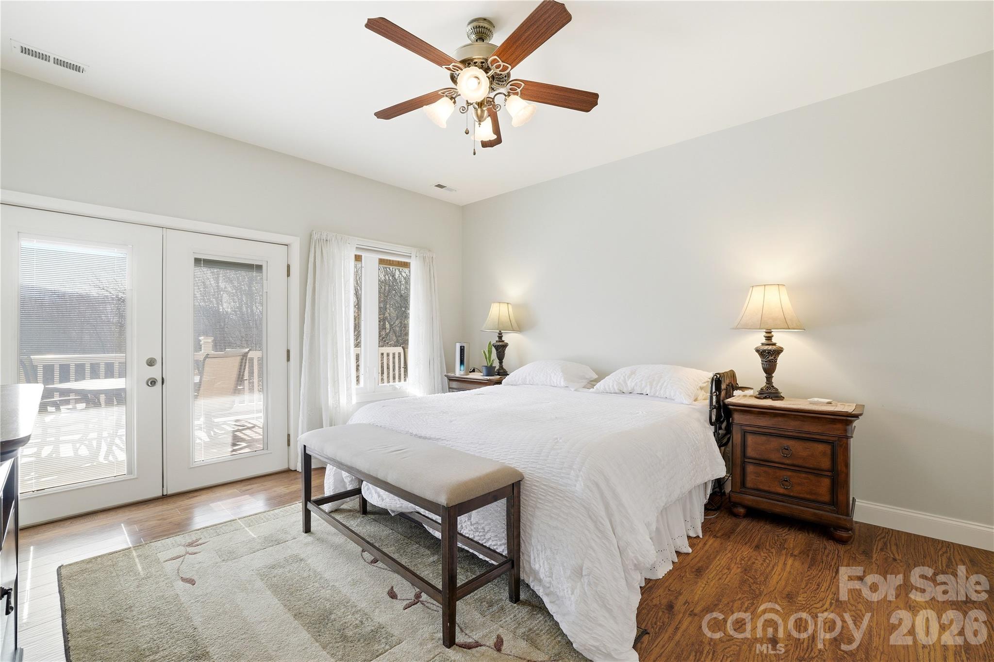 140 Debbie Loop Waynesville, NC 28786 - Photo 20 of 47 a bedroom with a bed and a chandelier