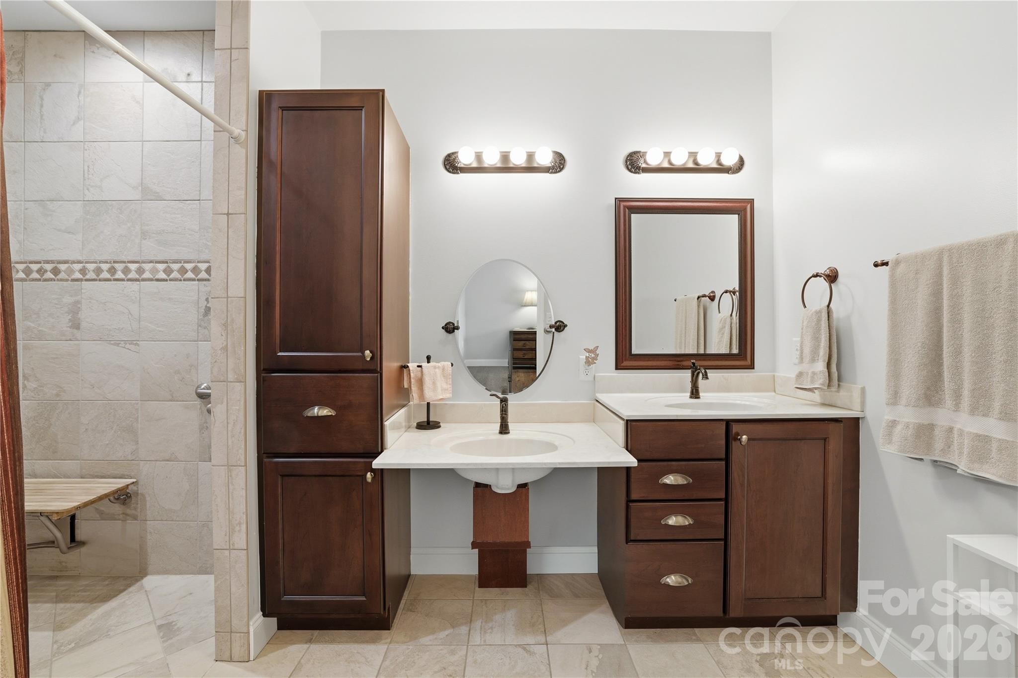 140 Debbie Loop Waynesville, NC 28786 - Photo 22 of 47 a bathroom with a double vanity sink and a mirror