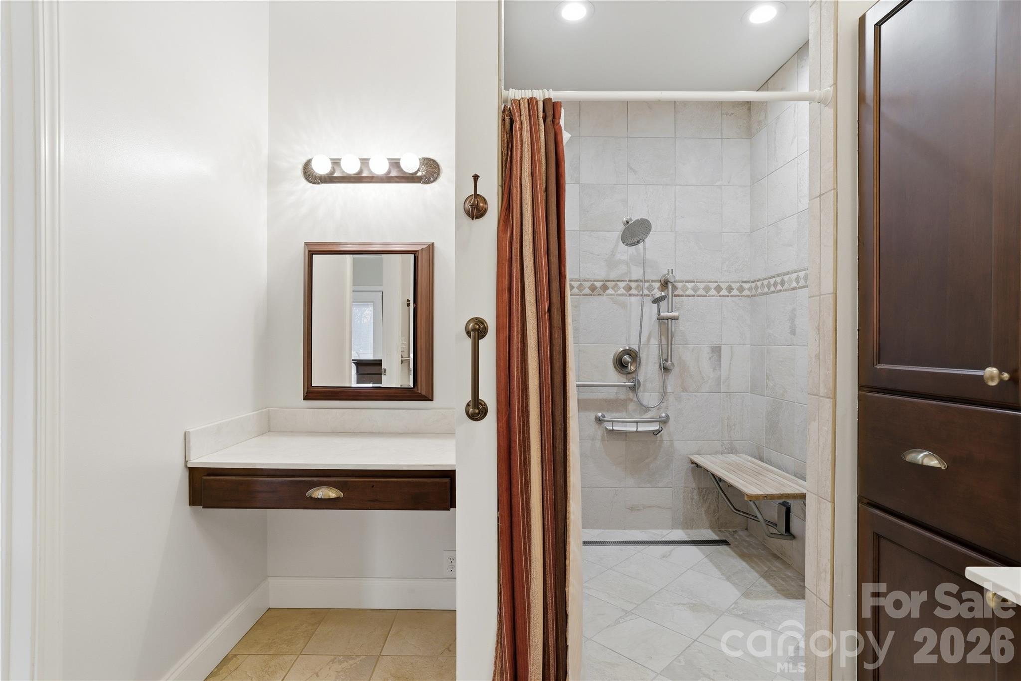 140 Debbie Loop Waynesville, NC 28786 - Photo 23 of 47 a bathroom with a toilet a sink and glass door
