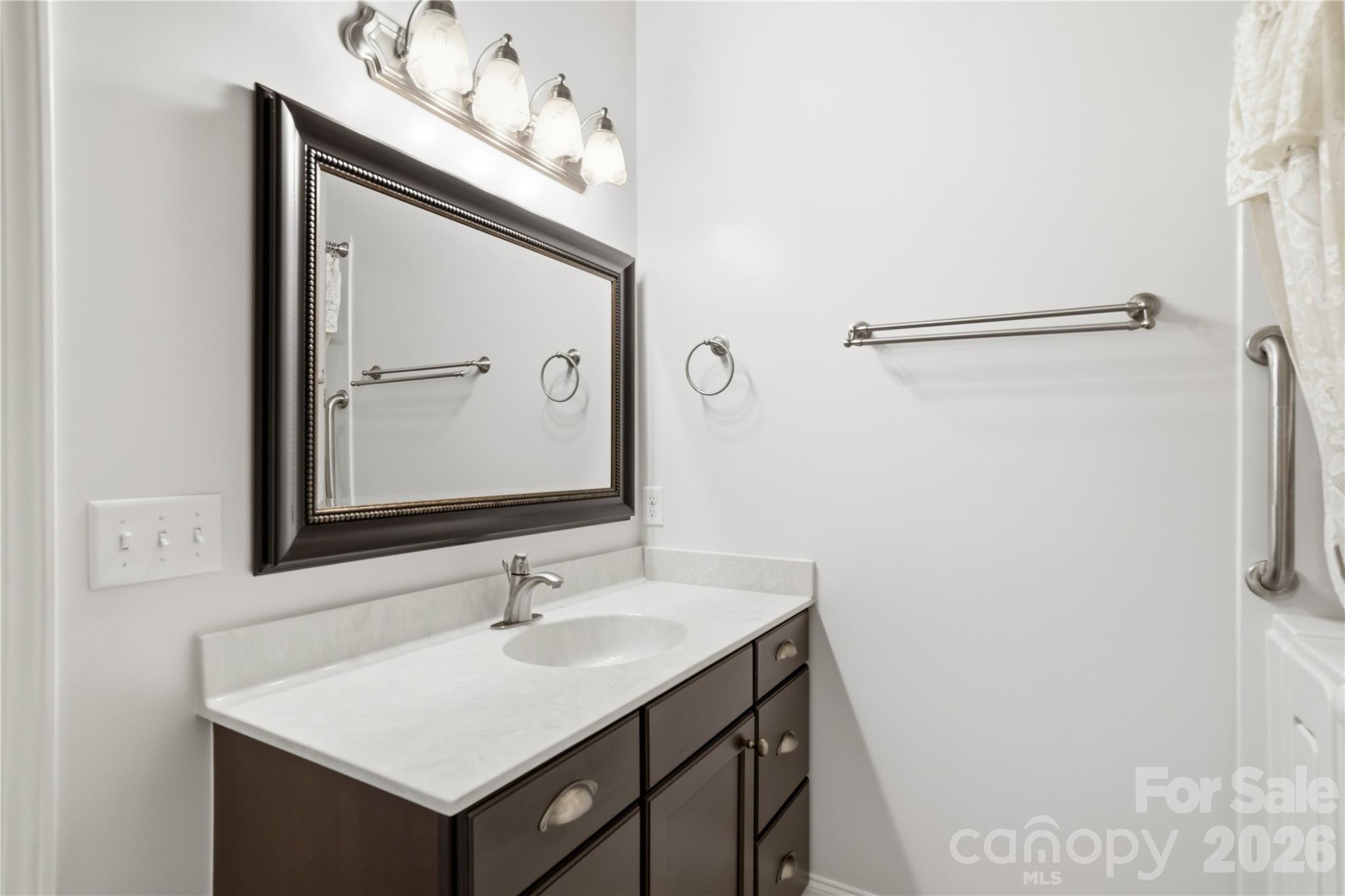 140 Debbie Loop Waynesville, NC 28786 - Photo 26 of 47 a bathroom with a sink vanity and a mirror