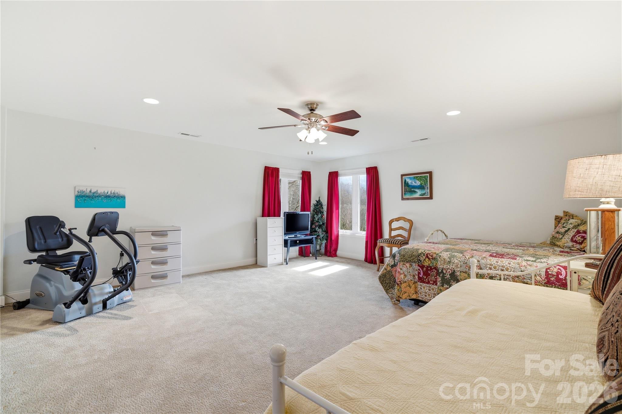 140 Debbie Loop Waynesville, NC 28786 - Photo 37 of 47 a bed room with a bed and a ceiling fan