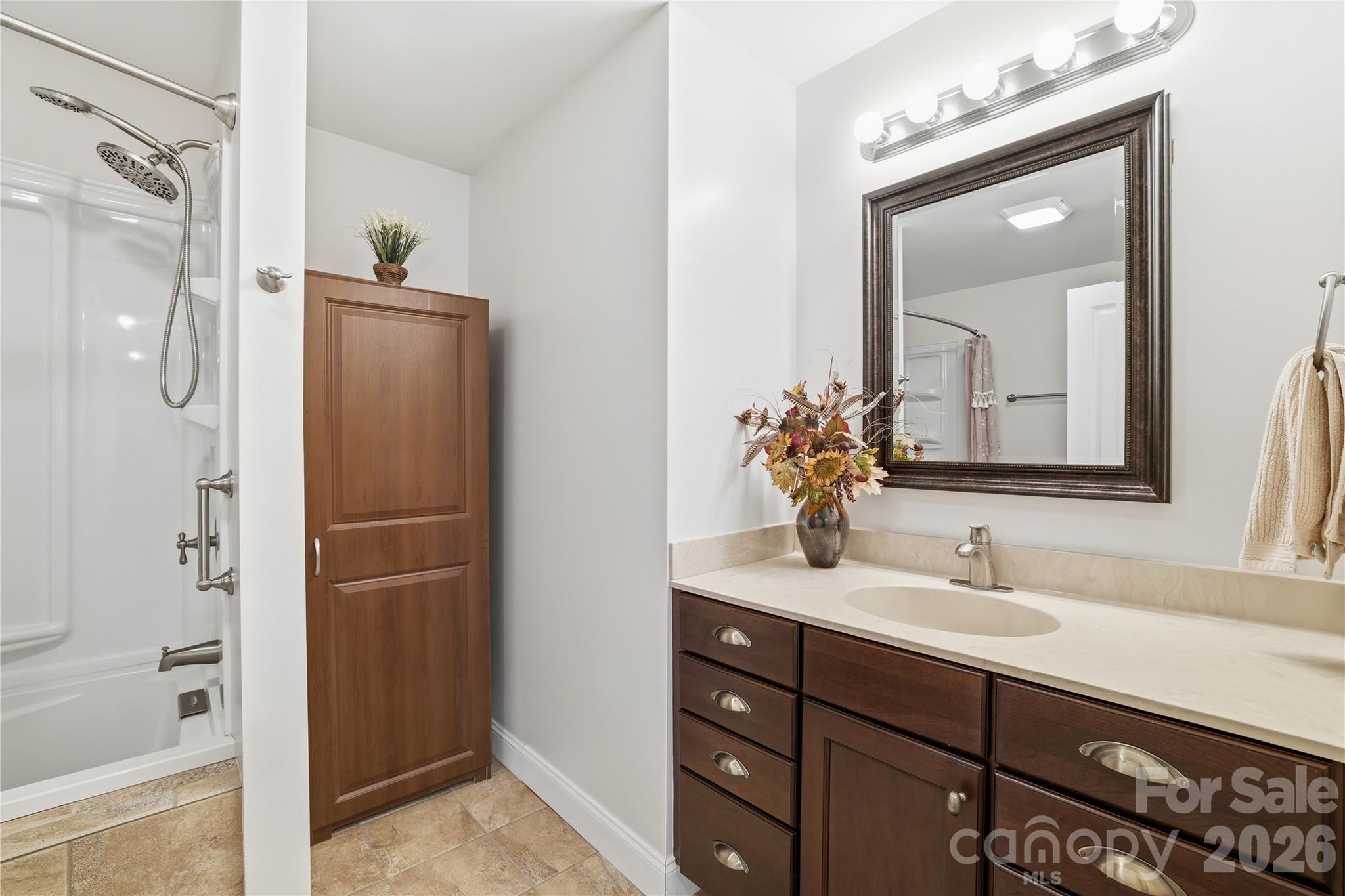 140 Debbie Loop Waynesville, NC 28786 - Photo 38 of 47 a bathroom with a double vanity sink mirror and shower