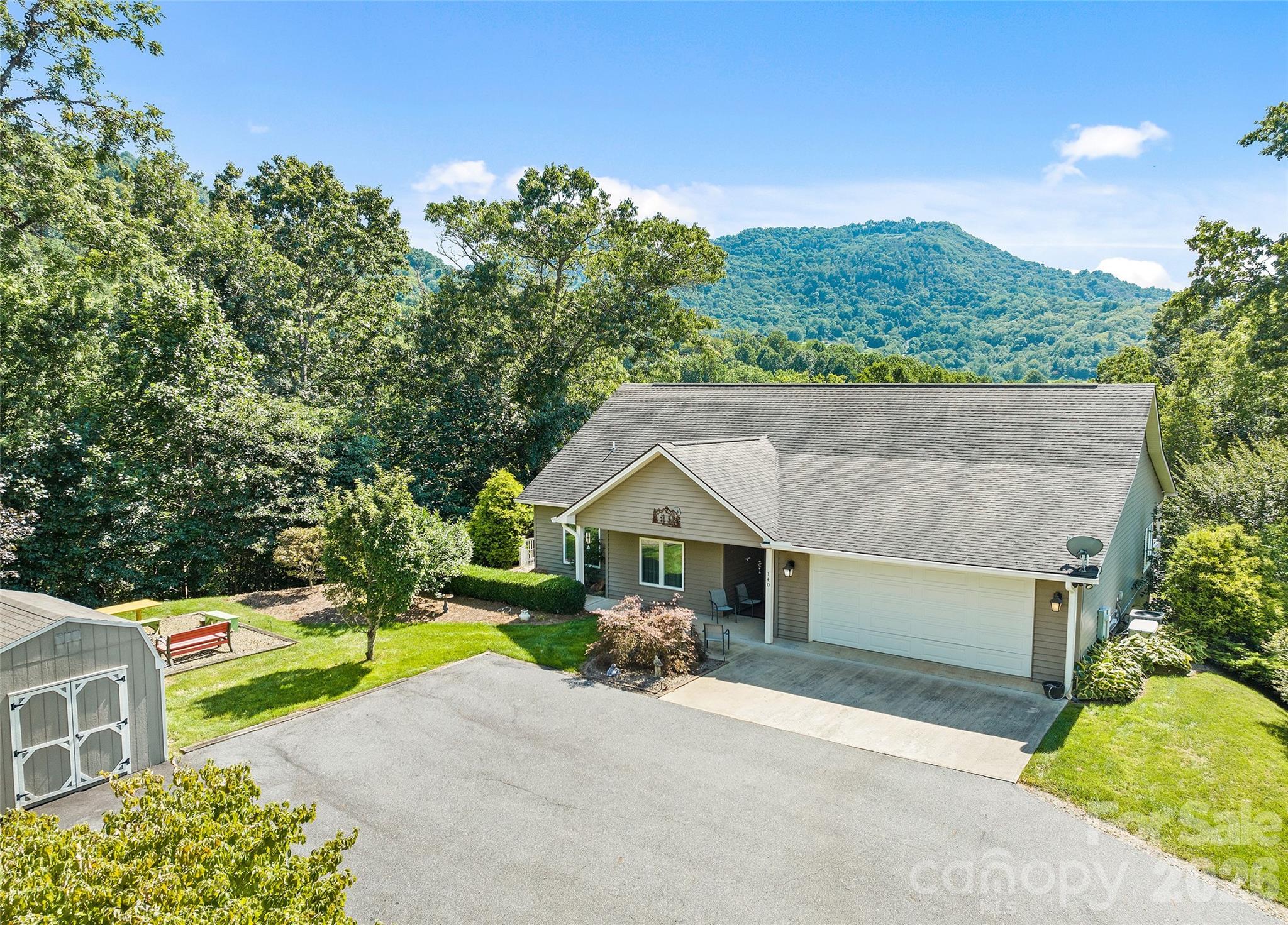 140 Debbie Loop Waynesville, NC 28786 - Photo 5 of 47 a house view with a garden space