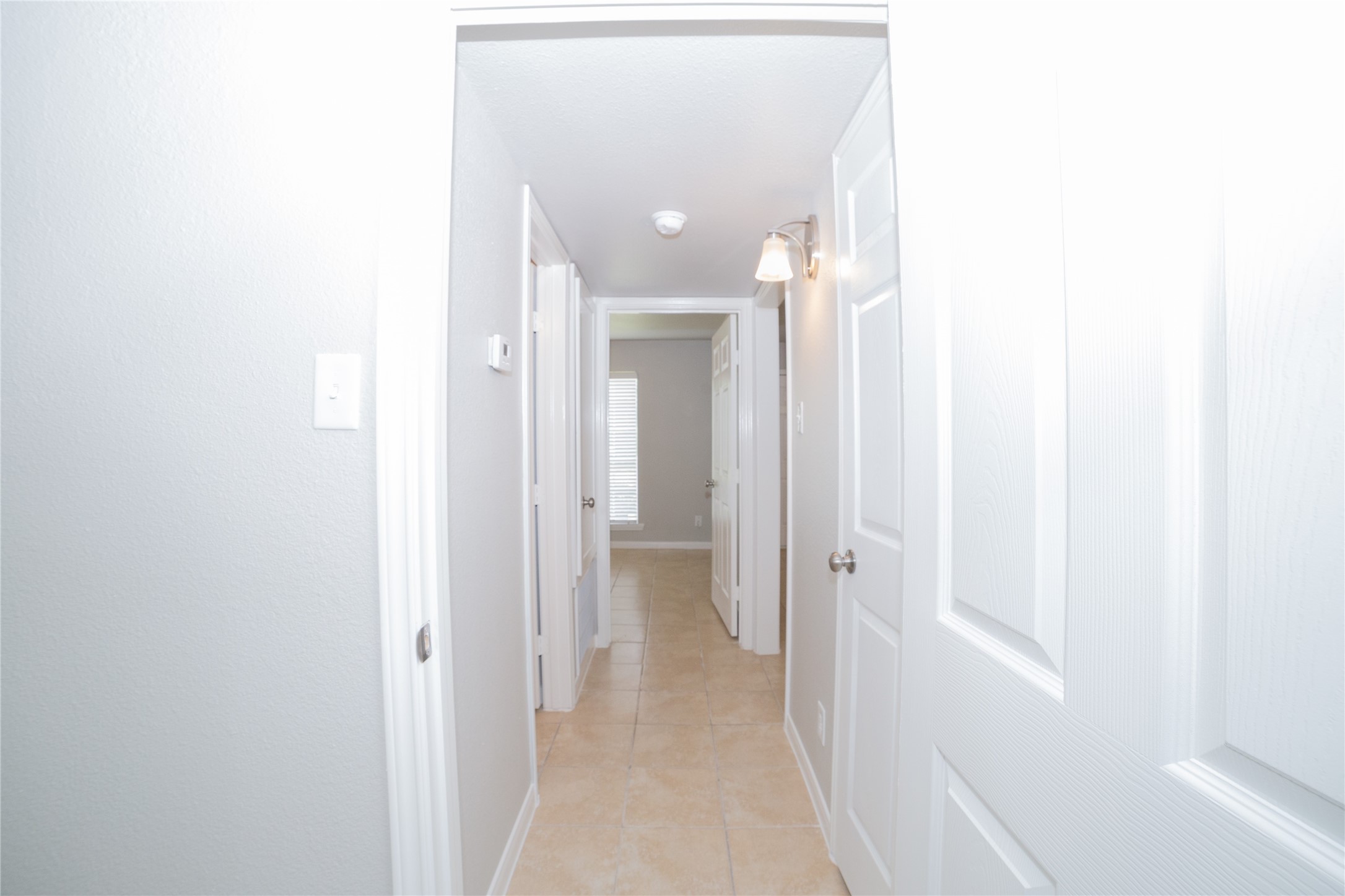 2010 North Travis Street, Unit 116 Liberty, TX 77575 - Photo 6 of 11 a view of a hallway with wooden floor and closet