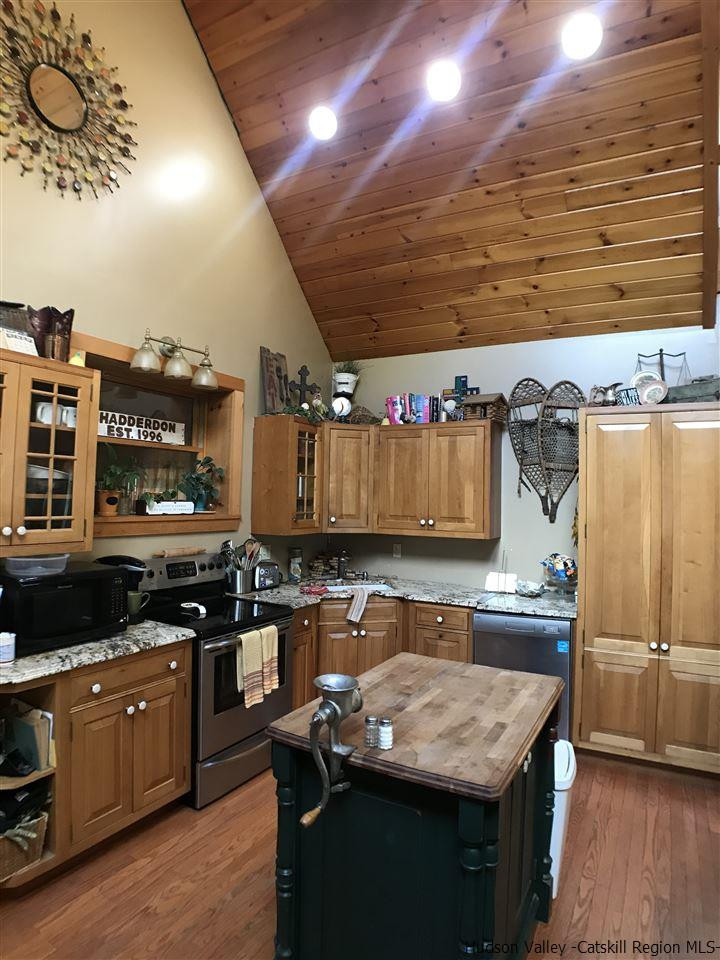 8 Bailey Road Purling, NY 12470 - Photo 6 of 21 a kitchen with a stove a sink and a refrigerator
