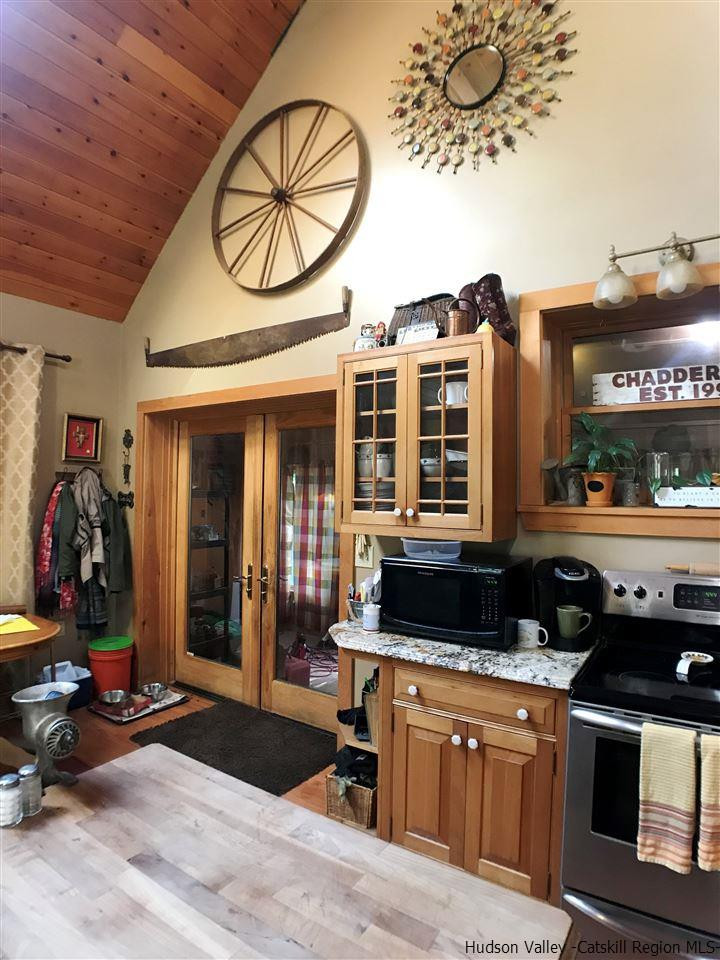 8 Bailey Road Purling, NY 12470 - Photo 7 of 21 a kitchen with a stove a microwave and cabinets