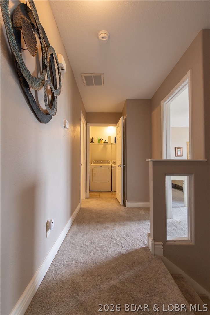 1106 Red Bud Road Osage Beach, MO 65065 - Photo 22 of 31 ... hallway upstairs looking toward laundry room