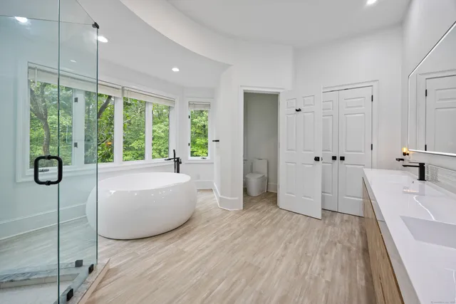 a bathroom with a bathtub and a shower