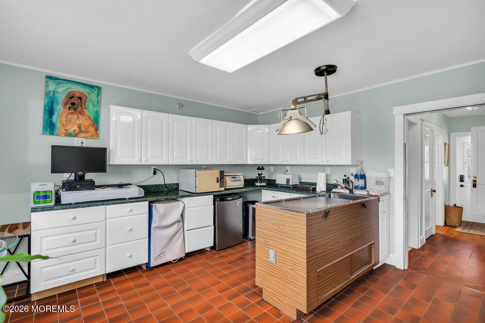 34 State Route Colts Neck, NJ 07722 - Photo 21 of 40 a kitchen with stainless steel appliances granite countertop a stove and a sink