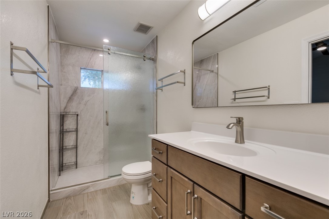 540 Sutters Mill Road Henderson, NV 89014 - Photo 39 of 46 This modern bathroom features a sleek vanity and a spacious, well-appointed shower.