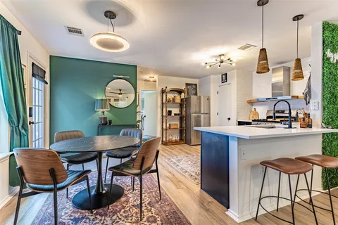 a view of a room with furniture and window