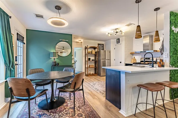 a view of a room with furniture and window