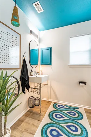 a bedroom with a bed and a mirror