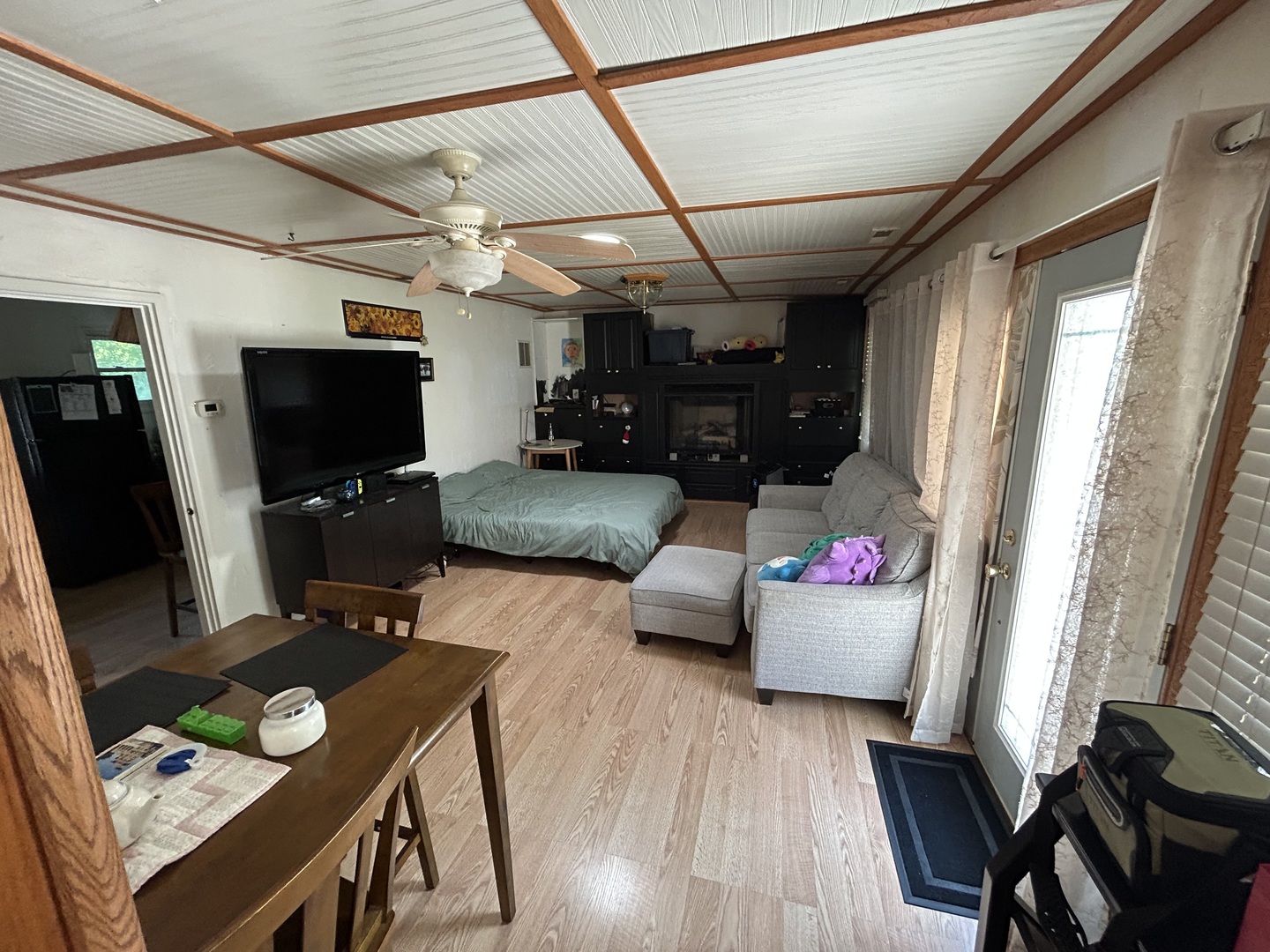 194 South Collins Street South Elgin, IL 60177 - Photo 2 of 48 a living room with furniture and a flat screen tv
