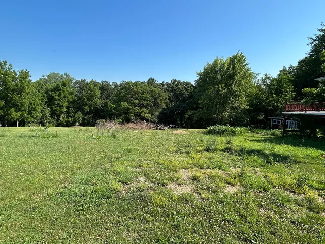 a view of a field with an outdoor space