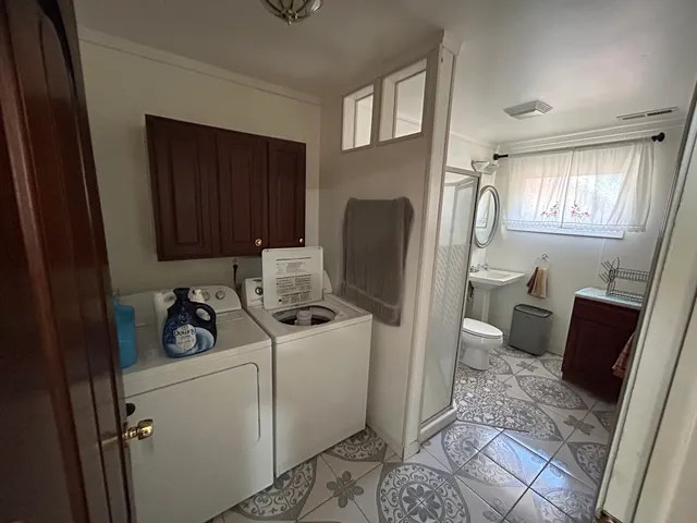 a room with refrigerator and washer