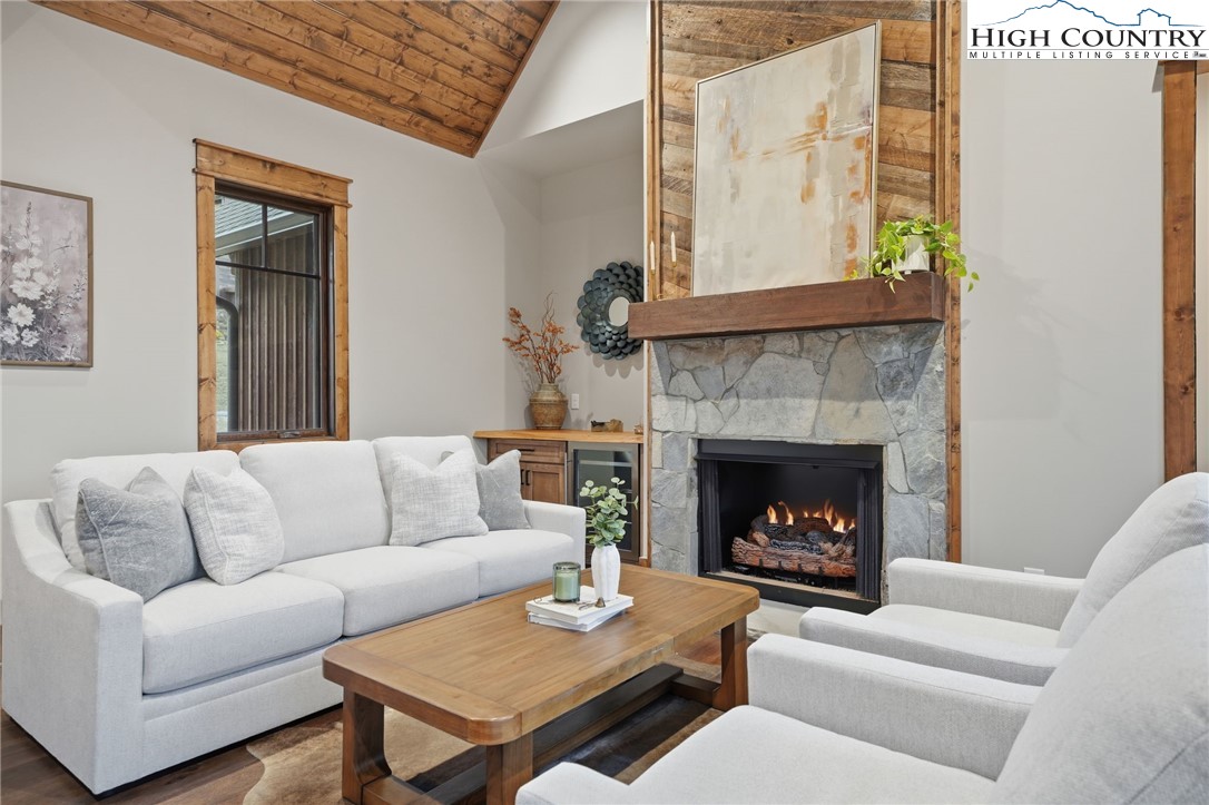 123 High Country Overlook Overlook, Unit OVERLOOK Banner Elk, NC 28604 - Photo 15 of 48 a living room with furniture and a fireplace
