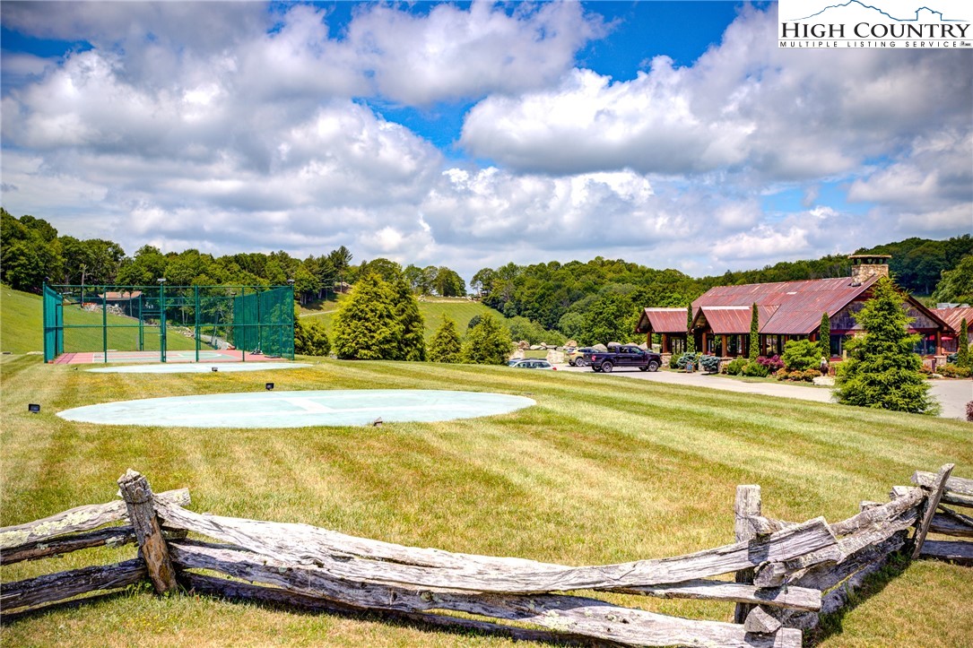 123 High Country Overlook Overlook, Unit OVERLOOK Banner Elk, NC 28604 - Photo 48 of 48 a view of a swimming pool with a table and chairs