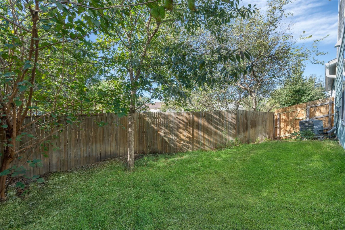 8922 Manchaca Road, Unit 906 Austin, TX 78748 - Photo 22 of 29 a backyard of a house with lots of green space