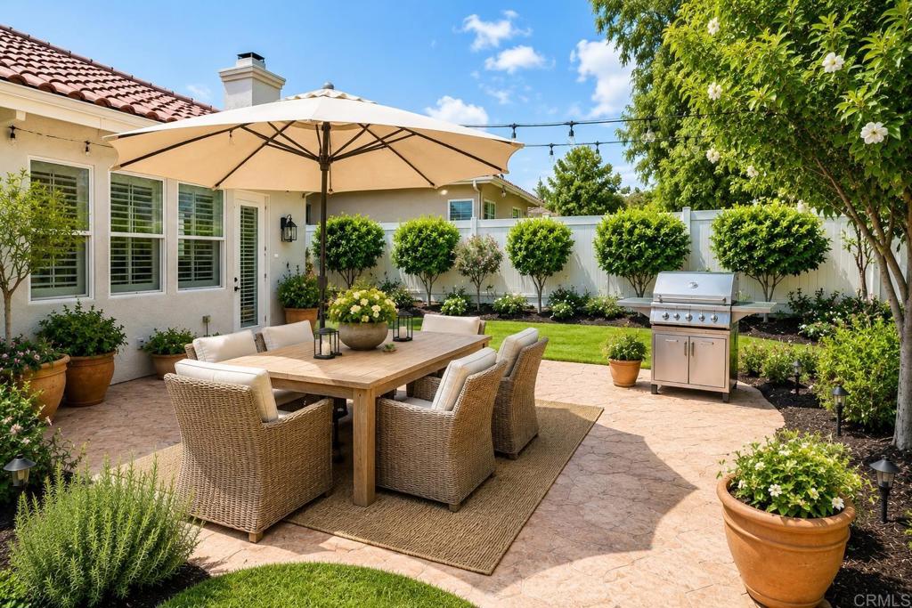 672 Inverlochy Drive Fallbrook, CA 92028 - Photo 57 of 75 a view of a house with backyard sitting area and garden