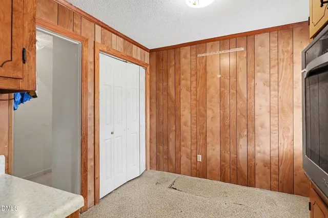 a view of a back yard with a wooden door